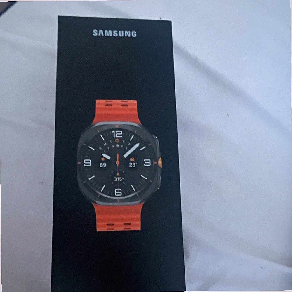 Samsung Galaxy Watch 50 mm Smartwatch Android schwarz mit Silikonarmband orange